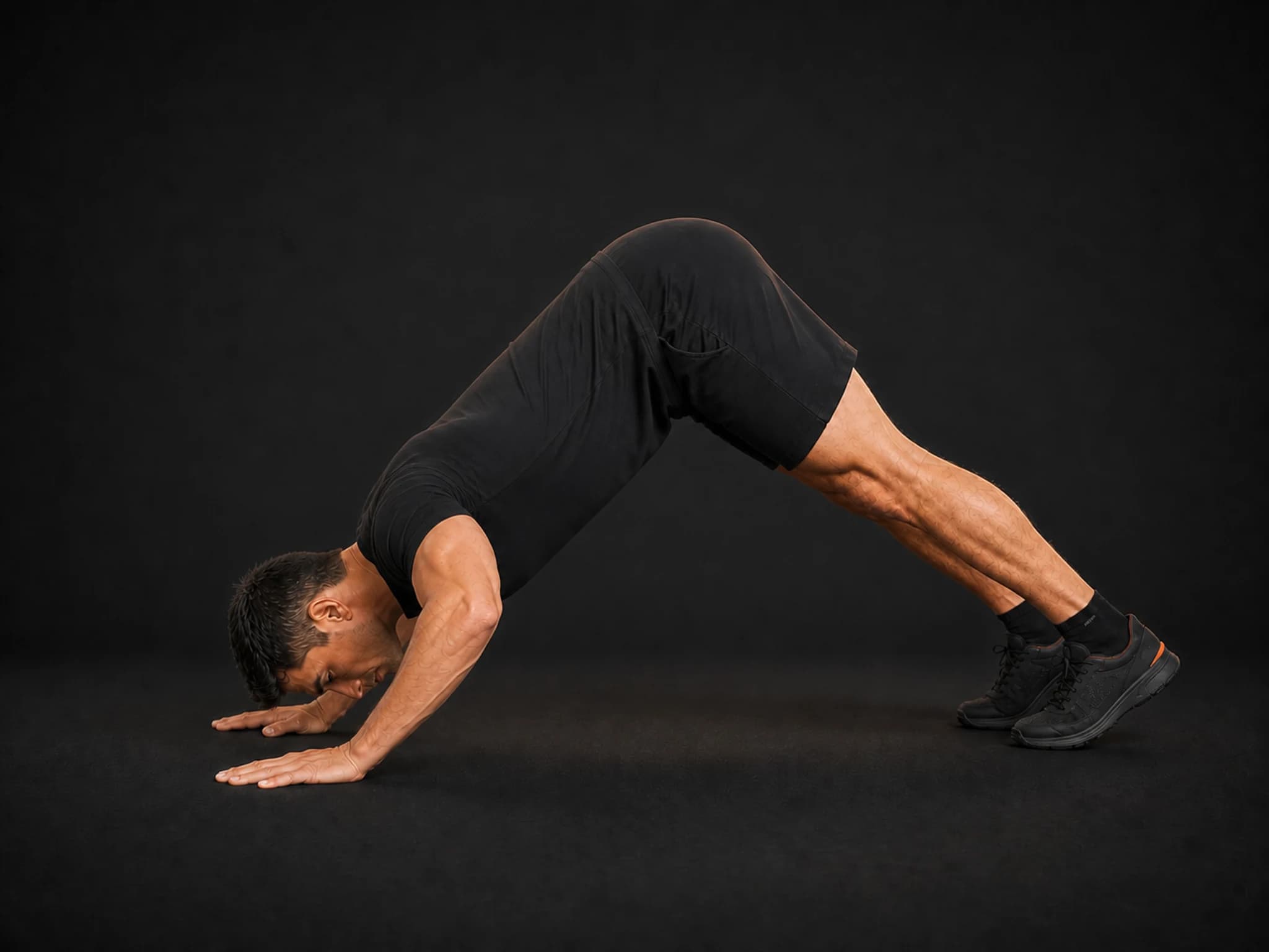 BraveREP athlete at the bottom of a pike push-up with the head close to the floor.