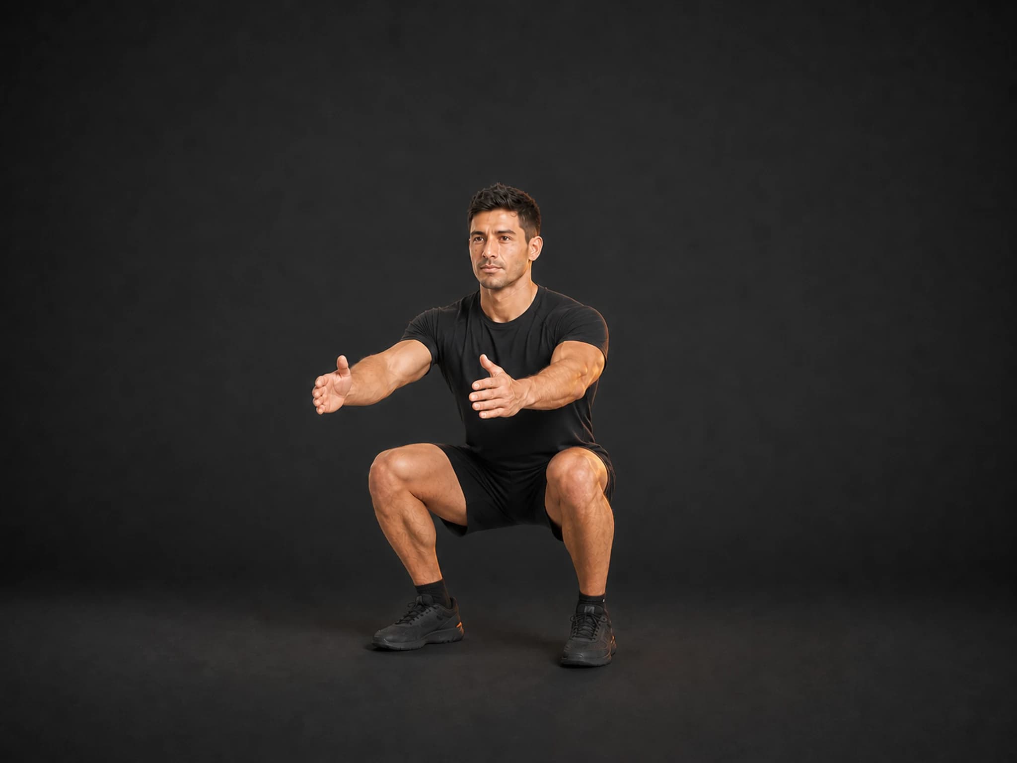 BraveREP athlete at the bottom of a squat with thighs near parallel and knees tracking over the toes.