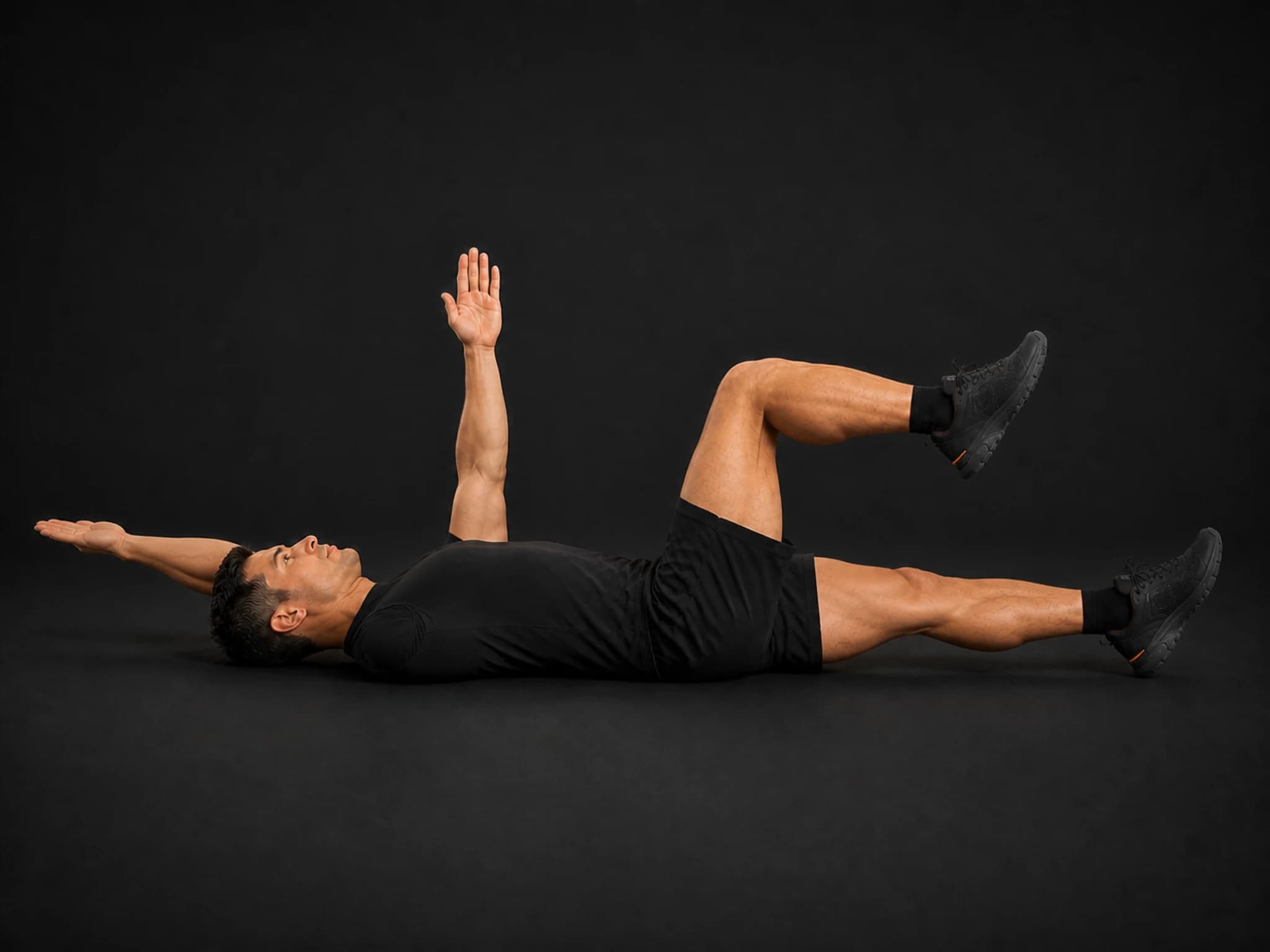 BraveREP athlete extending one arm and the opposite leg in a controlled dead bug.