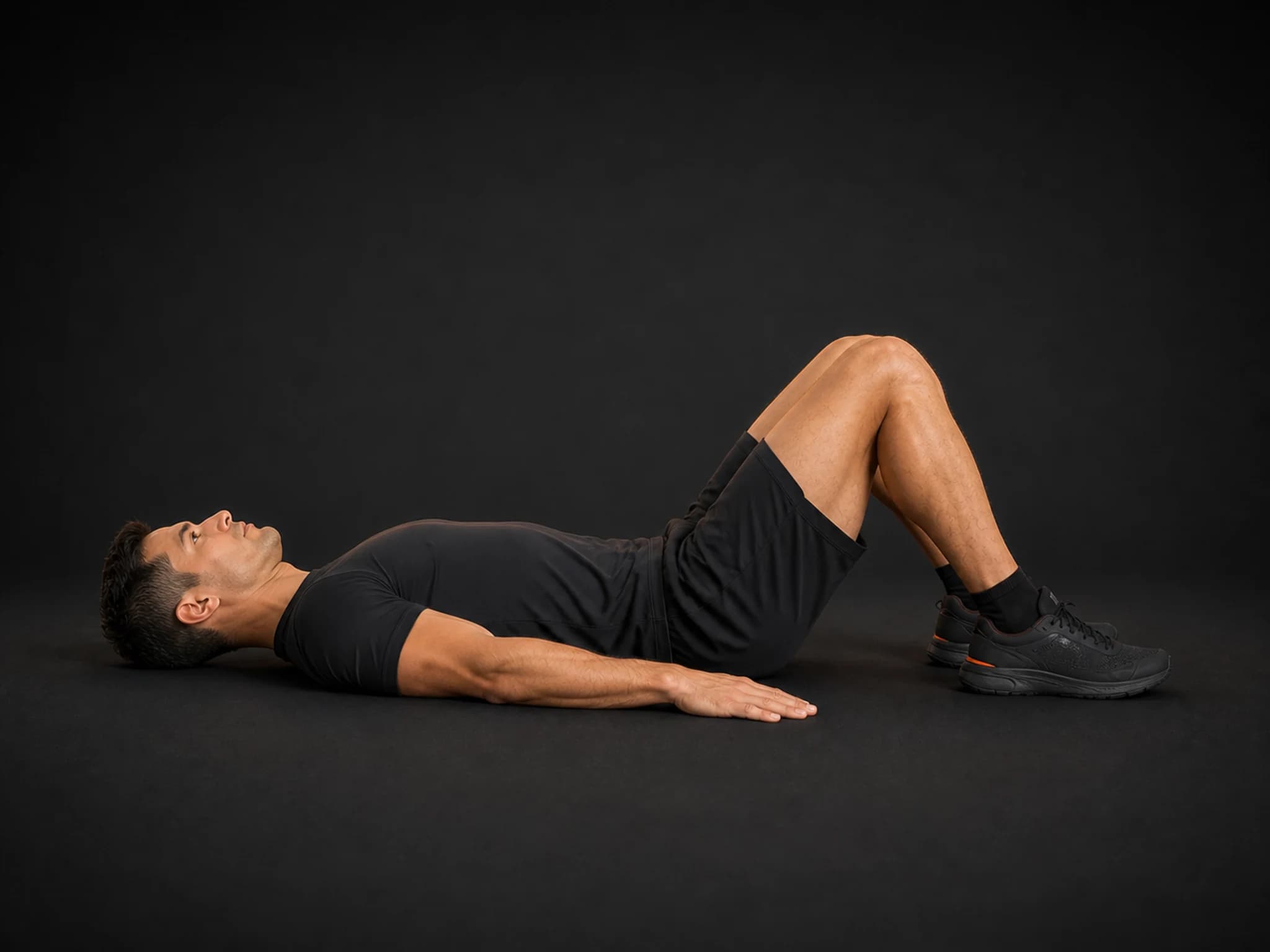 BraveREP athlete lying with knees bent in the starting position of a glute bridge.