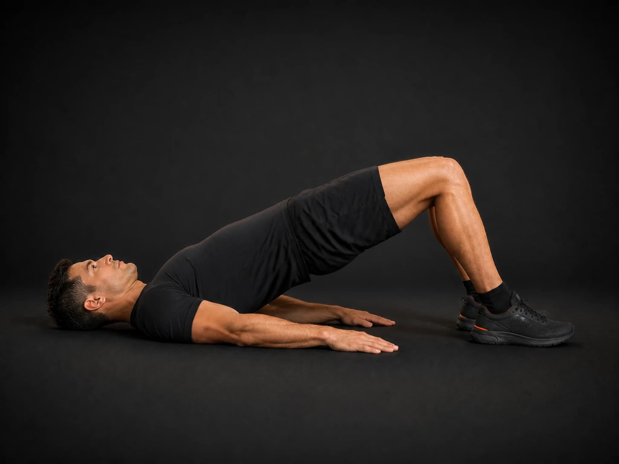 BraveREP athlete at the top of a glute bridge with shoulders, hips, and knees aligned.